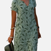 Sara | Midi-Jurk met Bladprint en V-Hals